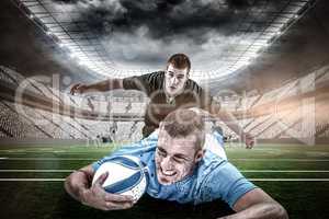 Composite image of confident rugby player lying in front with ball