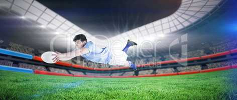 Composite image of a rugby player scoring a try