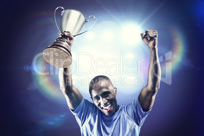 Composite image of portrait of happy sportsman cheering while ho