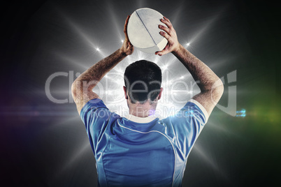 Composite image of rugby player about to throw a rugby ball