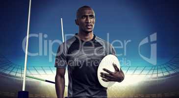Composite image of thoughtful athlete holding rugby ball