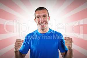 Composite image of portrait of happy rugby player