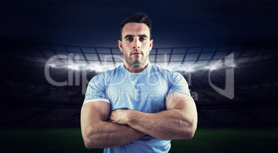 Composite image of rugby player looking at camera