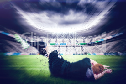 Composite image of a rugby player scoring a try