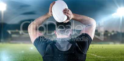 Composite image of tough rugby player throwing ball