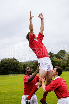 Rugby players jumping for line out