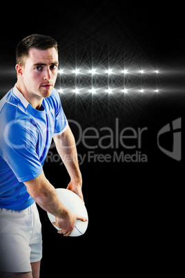 Composite image of rugby player about to throw a rugby ball