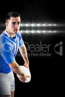 Composite image of rugby player about to throw a rugby ball