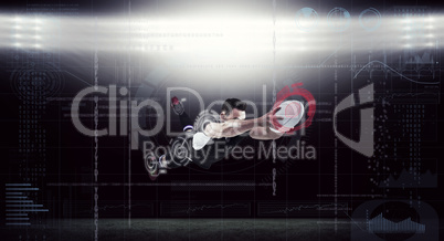 Composite image of rugby player scoring a try