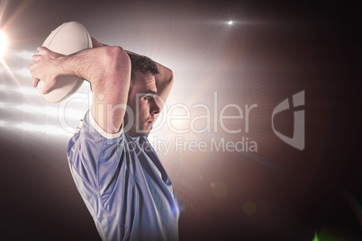 Composite image of rugby player about to throw a rugby ball