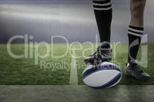 Composite image of rugby player in black socks on ball