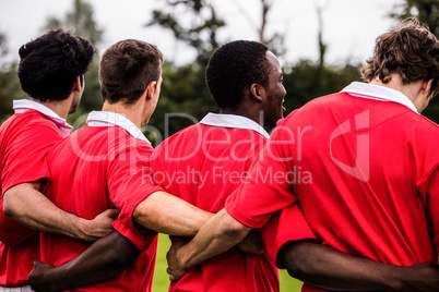 Rugby players standing together before match