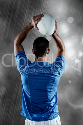 Composite image of rear view of rugby player throwing ball