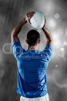 Composite image of rear view of rugby player throwing ball