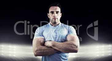 Composite image of rugby player looking at camera