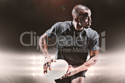 Composite image of athlete running with rugby ball