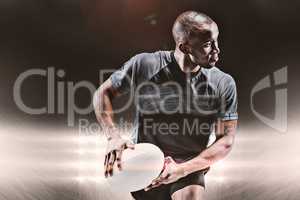 Composite image of athlete running with rugby ball