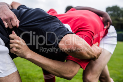 Rugby players doing a scrum