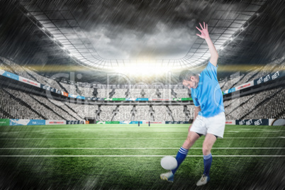 Composite image of rugby player kicking a rugby ball