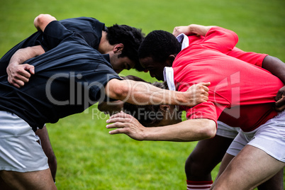 Rugby players doing a scrum