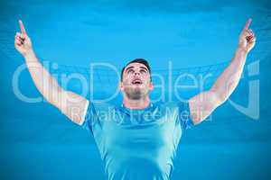 Composite image of rugby player cheering and pointing