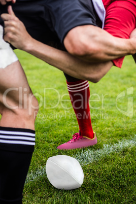 Rugby players doing a scrum