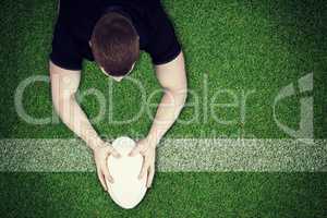 Composite image of a rugby player scoring a try