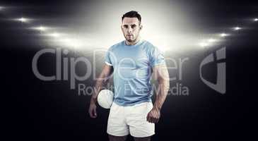 Composite image of rugby player looking at camera