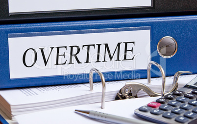 Overtime - blue binder in the office