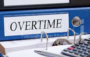 Overtime - blue binder in the office