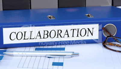 Collaboration - blue binder in the office
