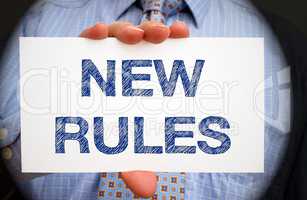 New Rules - Businessman with sign