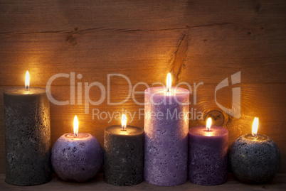 Christmas Decoration With Puprle And Black Candles