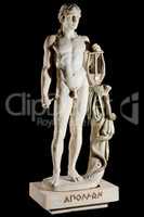 Classic painted marble statue of Apollo isolated on black background