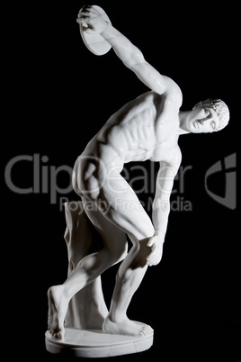 Classical white marble statue of naked discus thrower isolated on black background