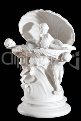 Classic white statue of Amors in the shell isolated on black background