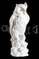 Classic white marble statuette of owl isolated on black background