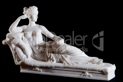 Classic white marble statue of a woman isolated on black background