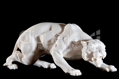 Classic white marble statuette of a panther isolated on black background