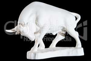 Classic white marble statuette of a bull isolated on black background