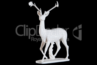 Classic white marble statuette of a deer isolated on black background