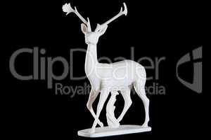 Classic white marble statuette of a deer isolated on black background