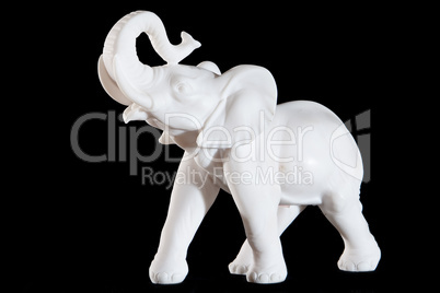 Classic white statue of a elephant isolated on black background