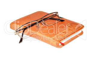 Glasses on the notebook