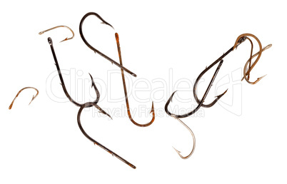 Rusty old fishhooks on white background