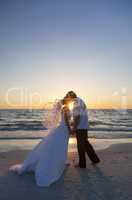 Bride and Groom Marriage Kissing Sunset Beach Wedding