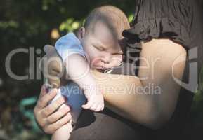 Baby in his mother's arms