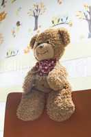 Teddy bear in a baby room
