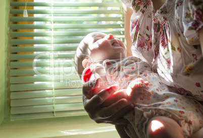 Baby and mom to the window