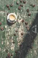 Cup of coffee on wooden table.